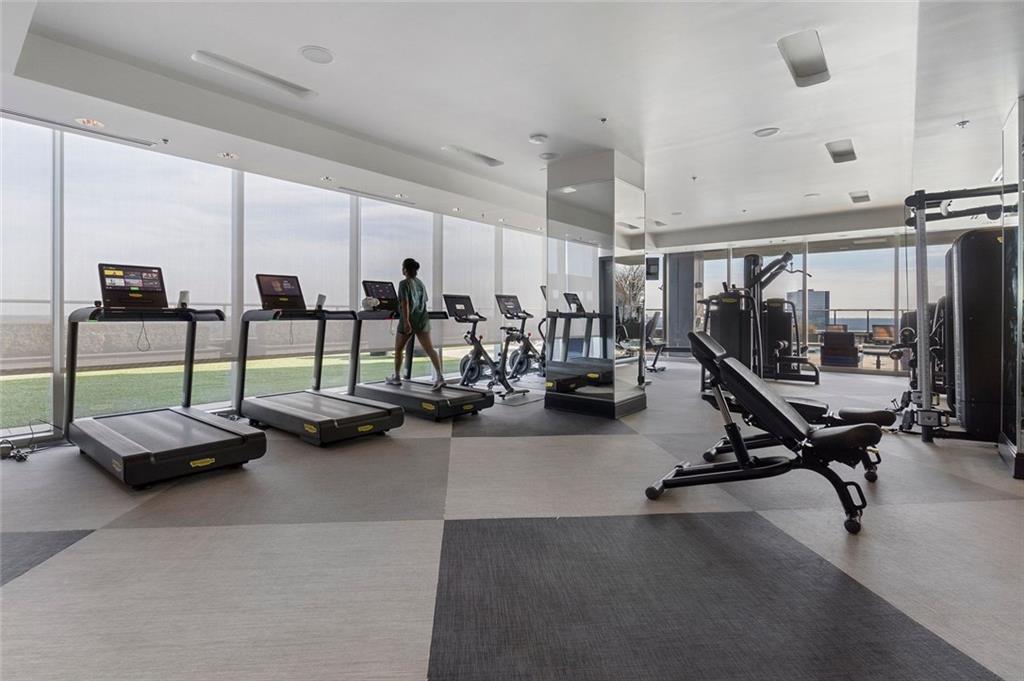 3630 Peachtree Road Northeast, Unit 2104 Atlanta, GA 30326 - Photo 87 of 98 a view of a room with gym equipment