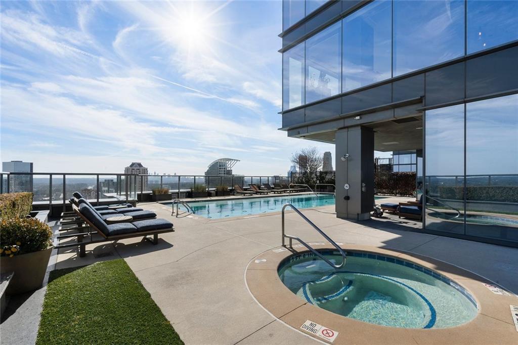 3630 Peachtree Road Northeast, Unit 2104 Atlanta, GA 30326 - Photo 92 of 98 a view of a swimming pool with outdoor seating