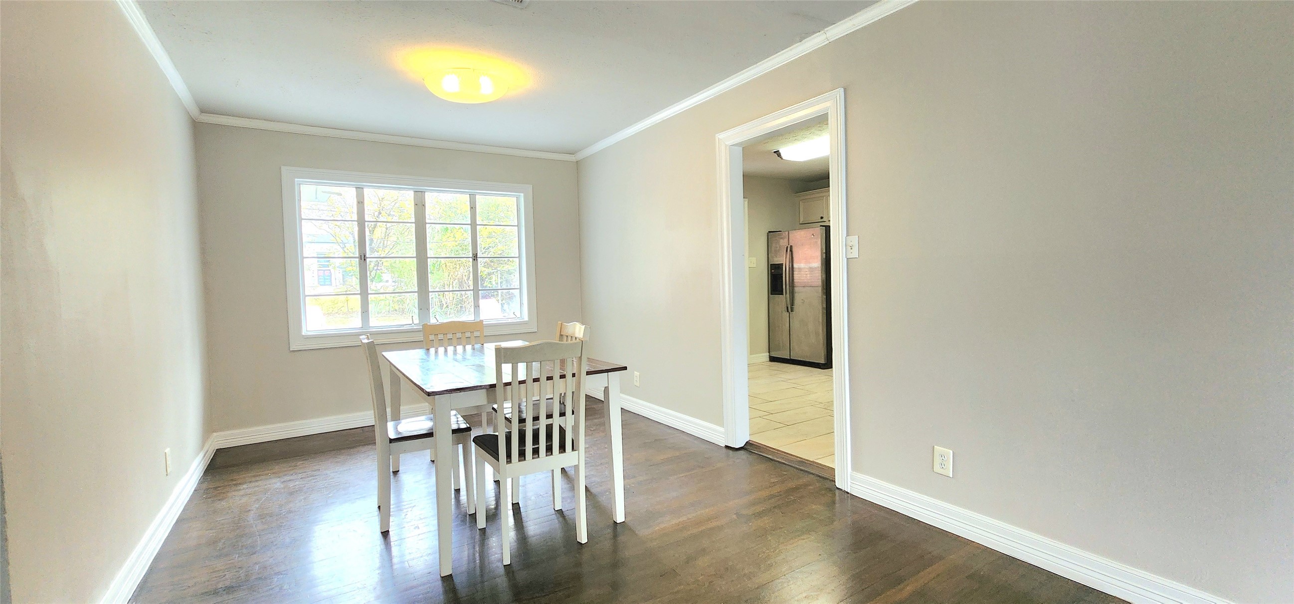 6927 Burgess Street Houston, TX 77021 - Photo 8 of 22 a view of a dining room with furniture and wooden floor