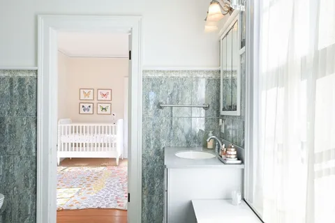 a picture of a bathroom with a window