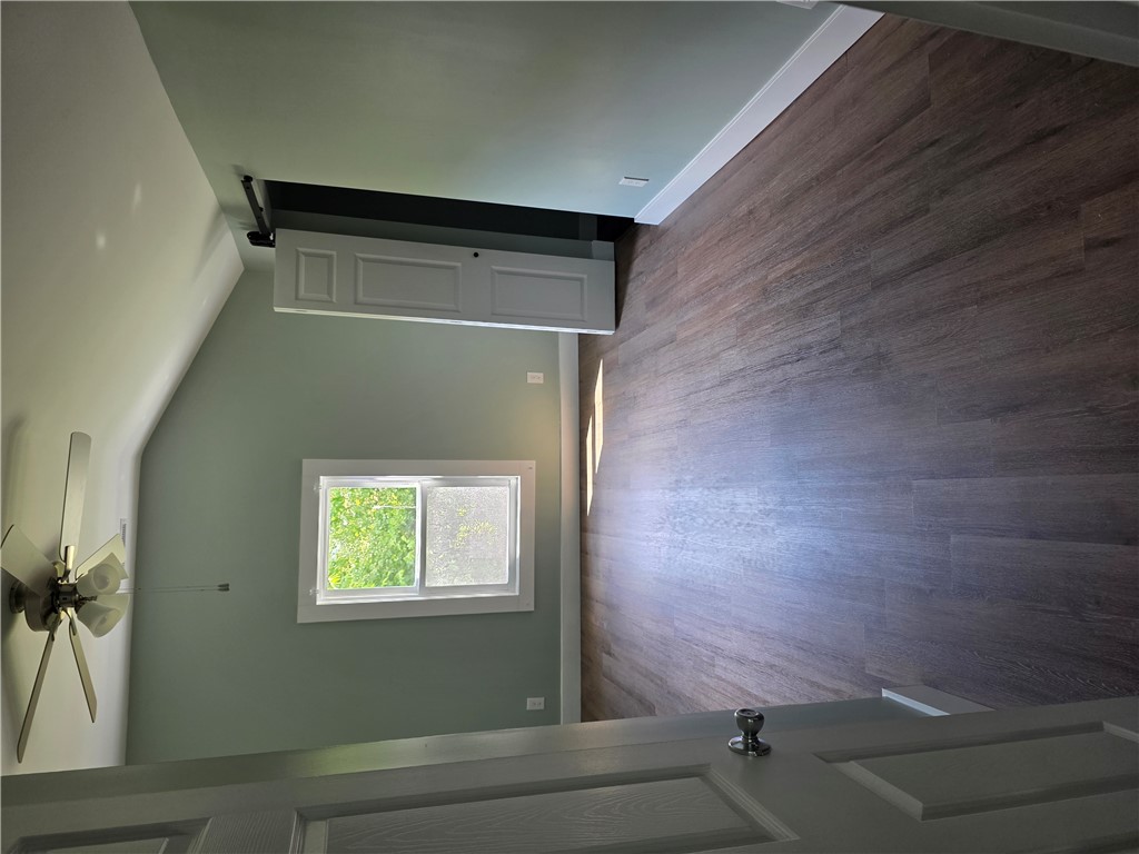 112 Simmons Street Anderson, SC 29625 - Photo 11 of 26 Rich hardwood floors complement light green walls in this inviting room.