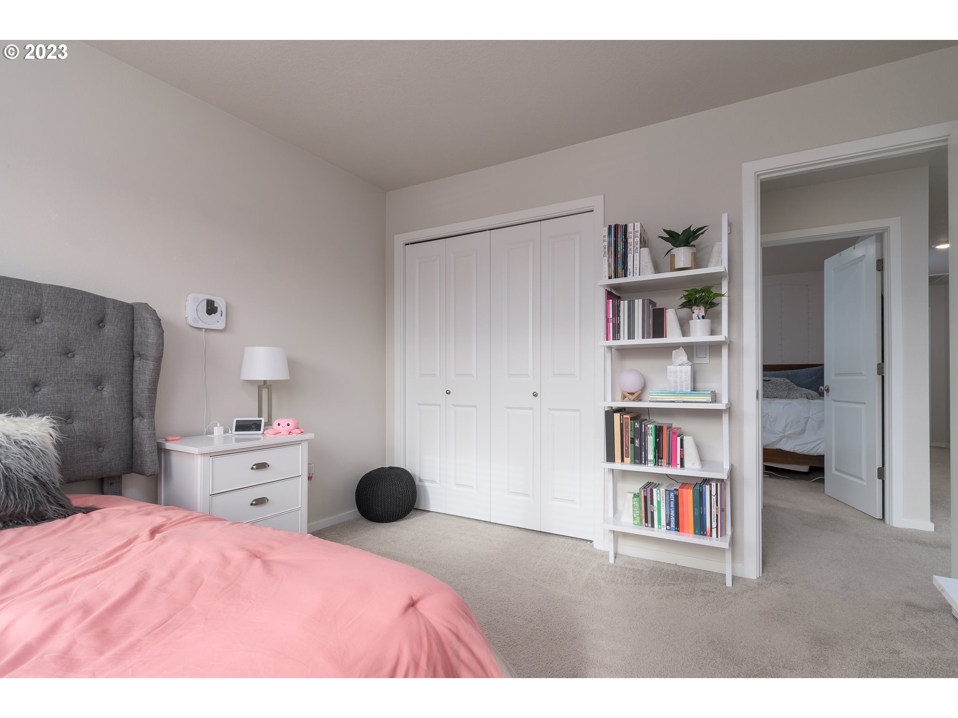 2914 Fenya Street Springfield, OR 97477 - Photo 22 of 35 a bedroom with a bed and a book shelf