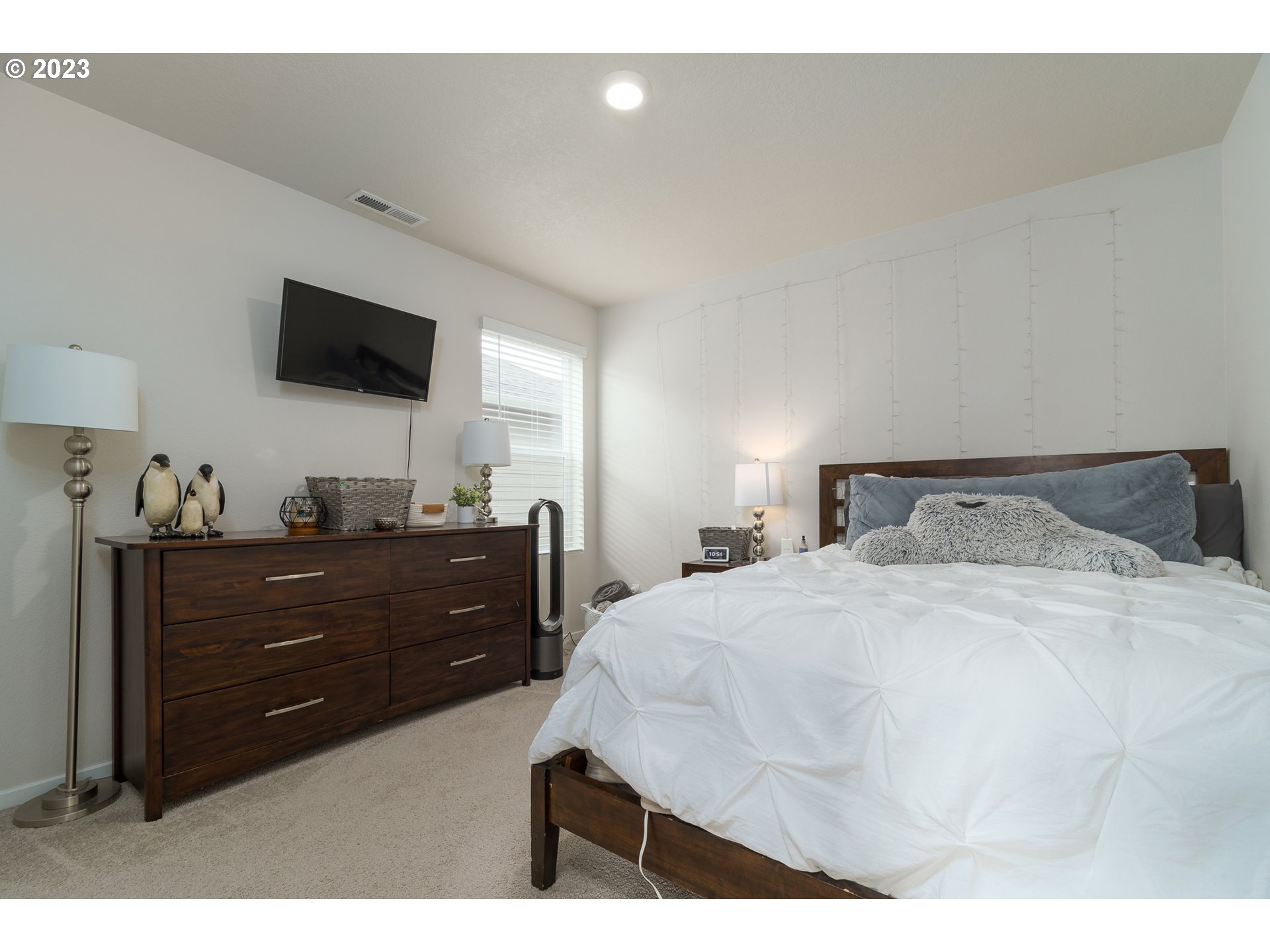 2914 Fenya Street Springfield, OR 97477 - Photo 23 of 35 a bedroom with a bed and a flat screen tv