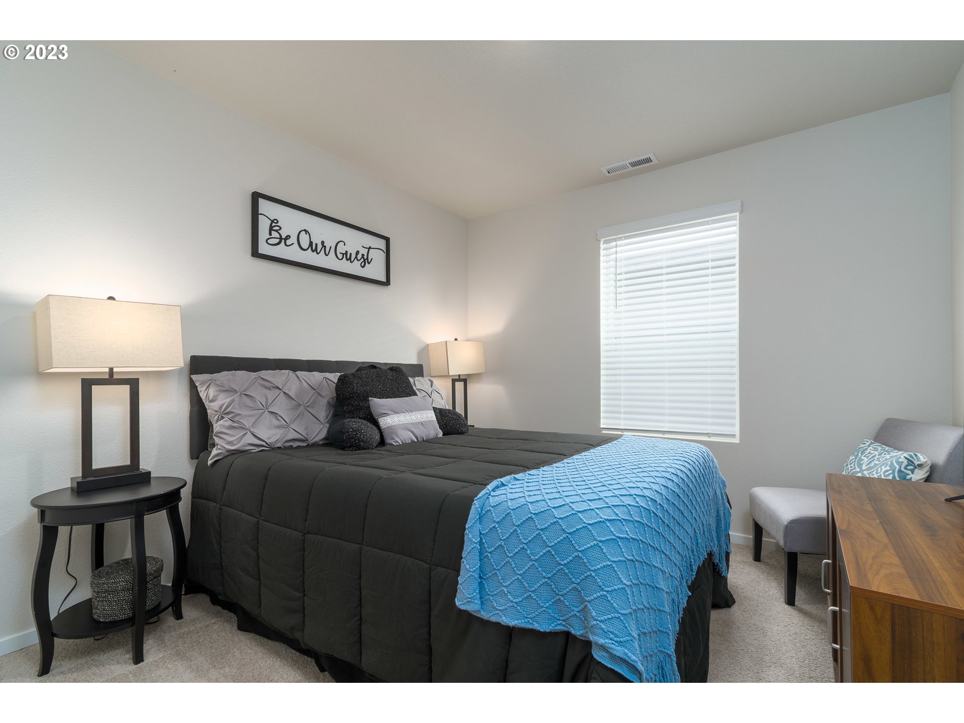 2914 Fenya Street Springfield, OR 97477 - Photo 25 of 35 a bedroom with a bed a lamp and a window