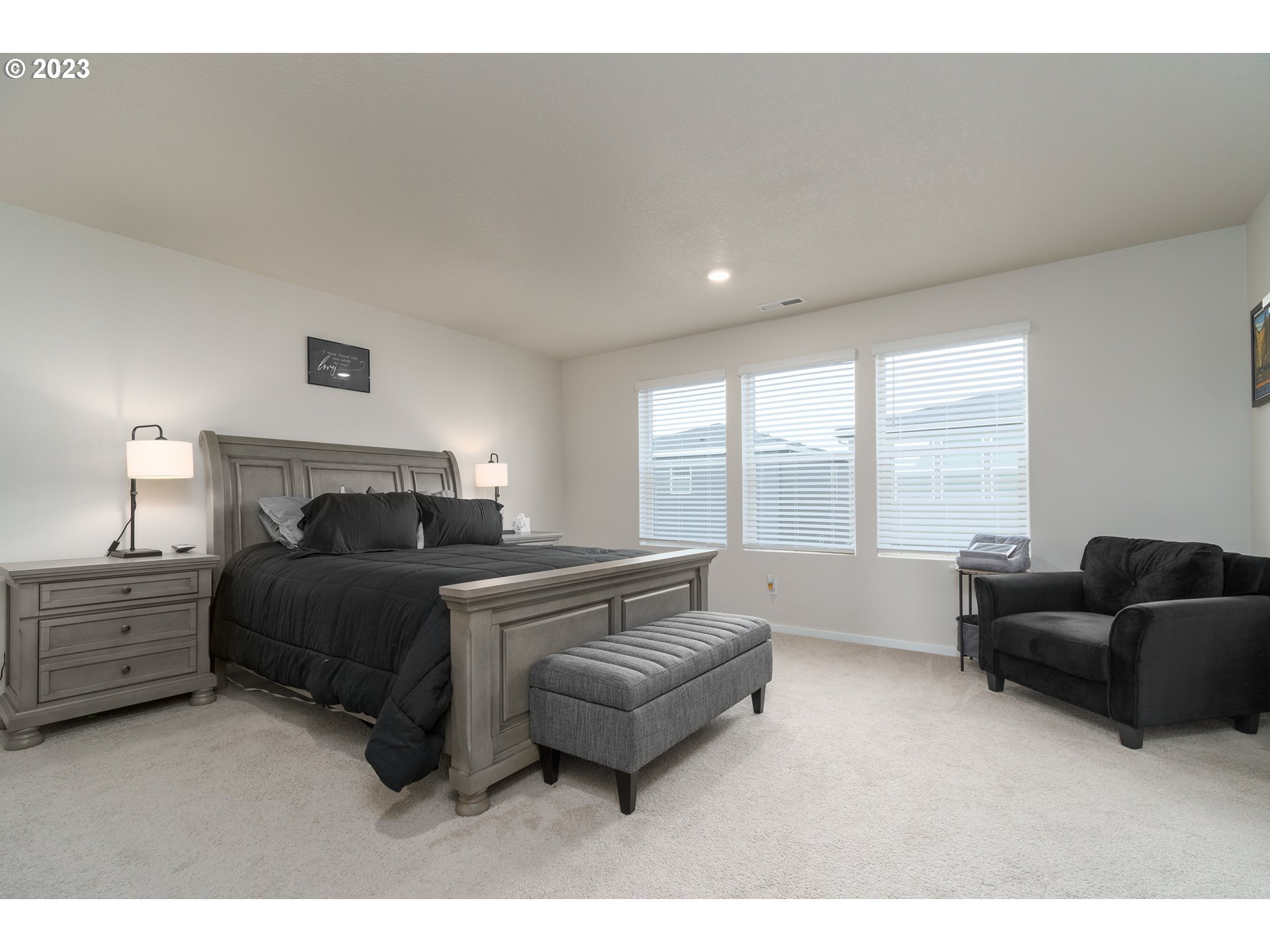 2914 Fenya Street Springfield, OR 97477 - Photo 27 of 35 a spacious bedroom with a bed and glass window