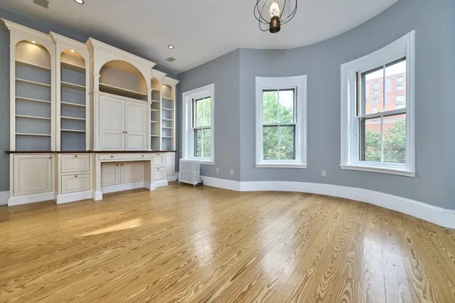 a view of a balcony with two chairs and a table
