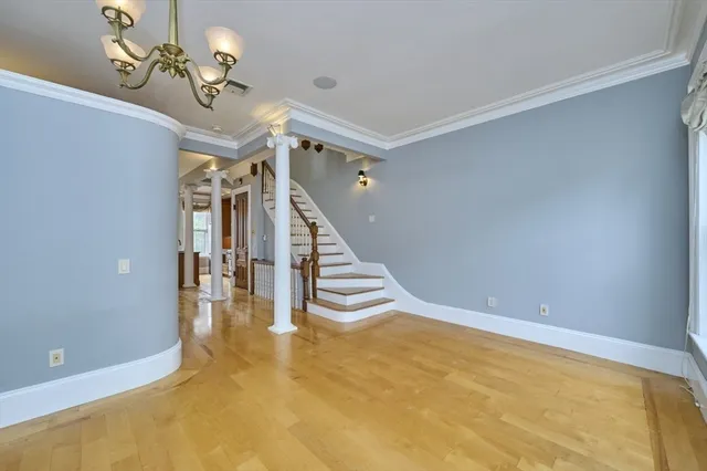 a view of entryway and hall with a chandelier