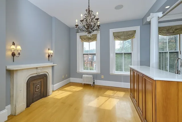 a bathroom with a sink a mirror and a window