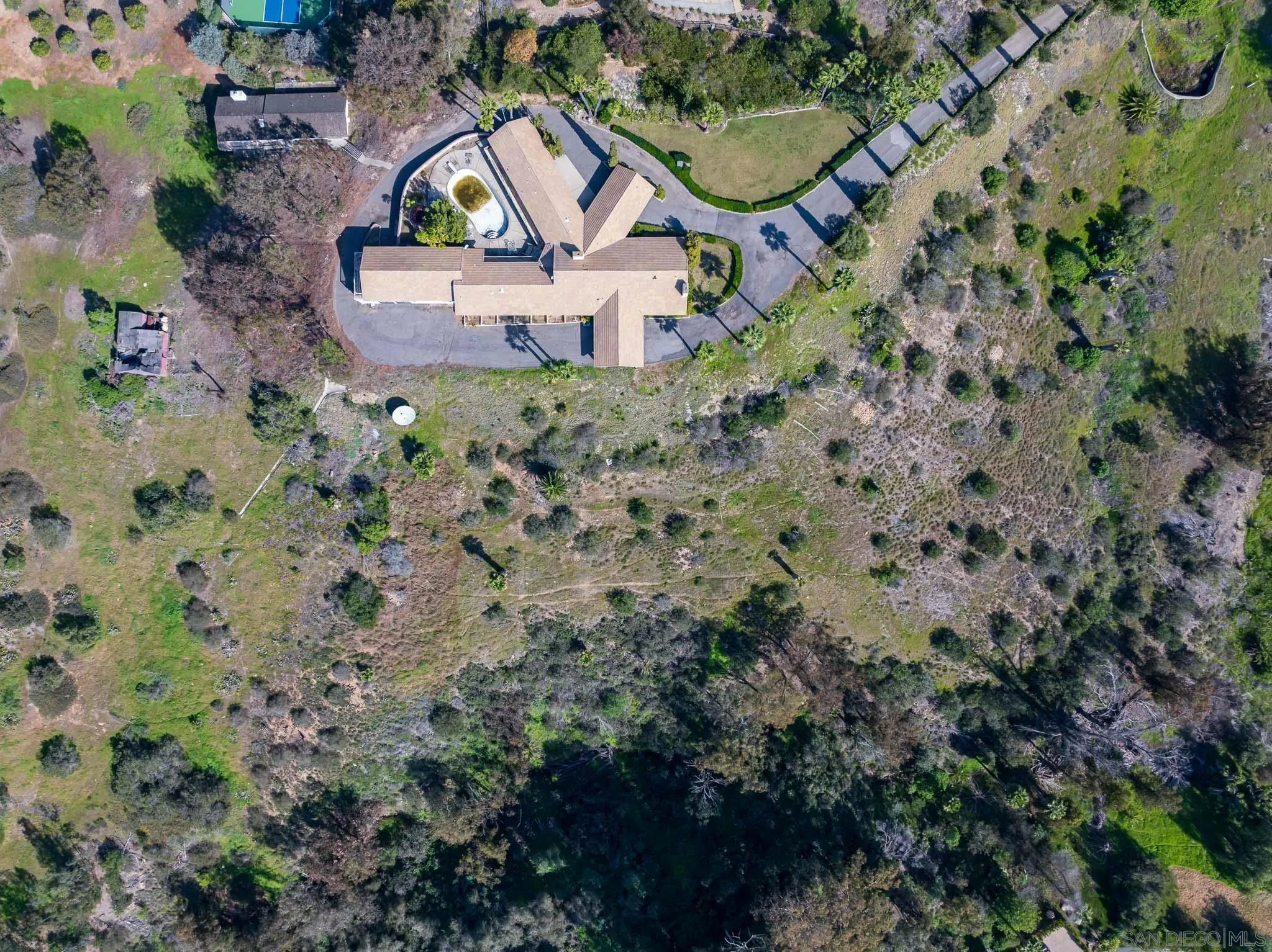 18024 Avenida Alondra Rancho Santa Fe, CA 92067 - Photo 12 of 25 an aerial view of a house with a yard and lake view