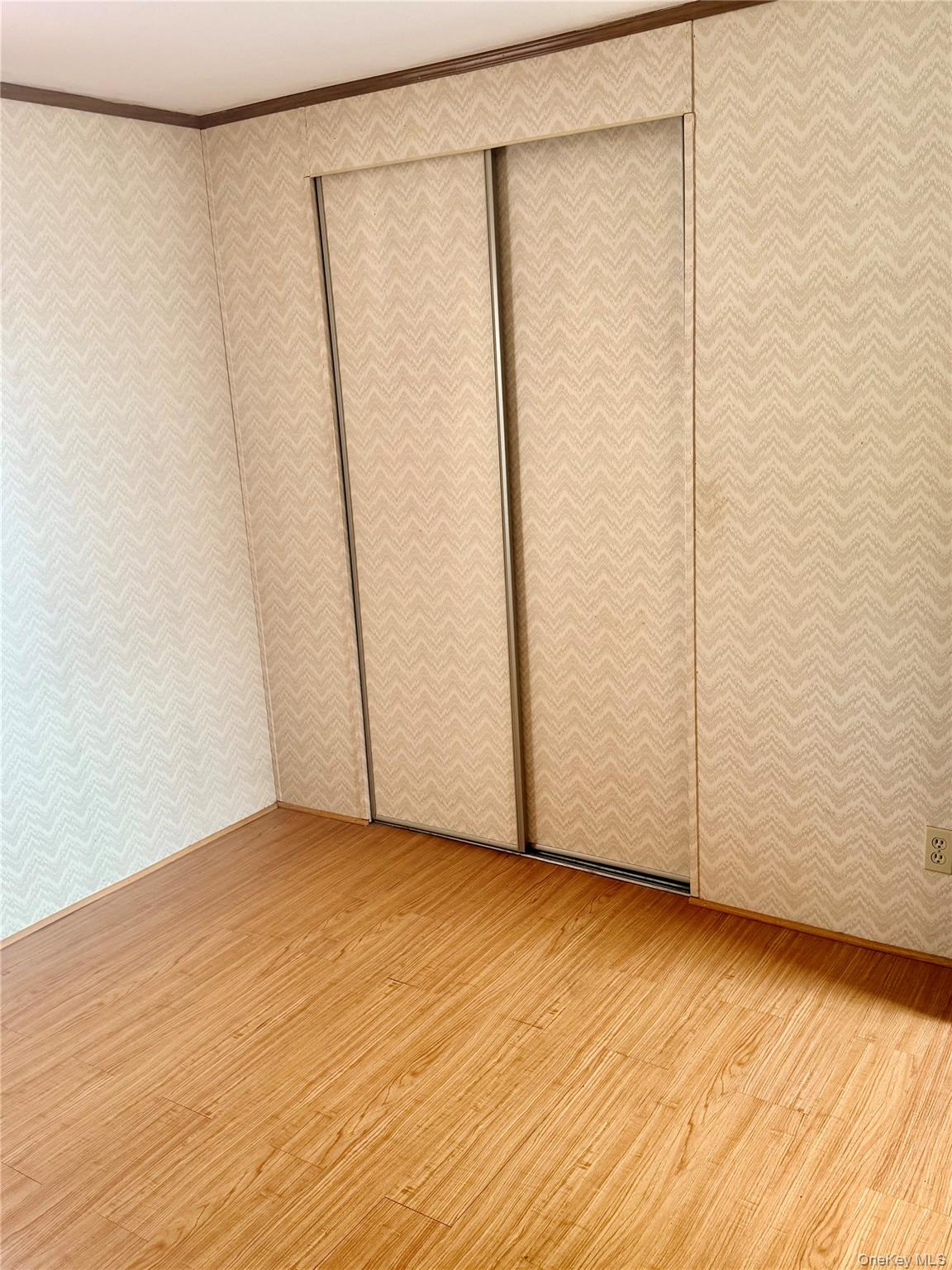 63 Tanglewood Road Hopewell Junction, NY 12533 - Photo 14 of 25 a view of an empty room with wooden floor