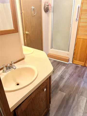a bathroom with a sink a mirror and a toilet