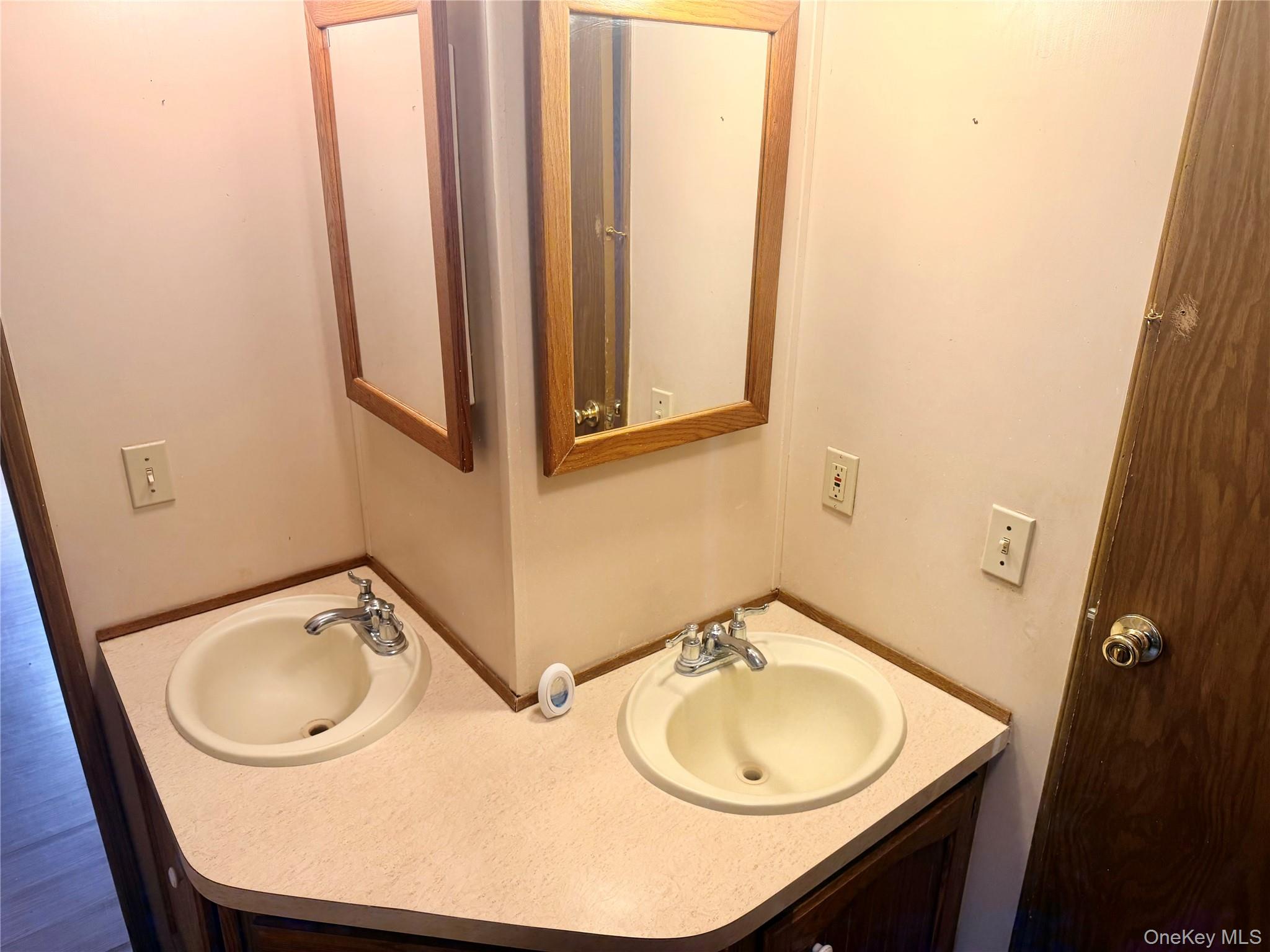 63 Tanglewood Road Hopewell Junction, NY 12533 - Photo 21 of 25 a bathroom with a sink a mirror and a toilet