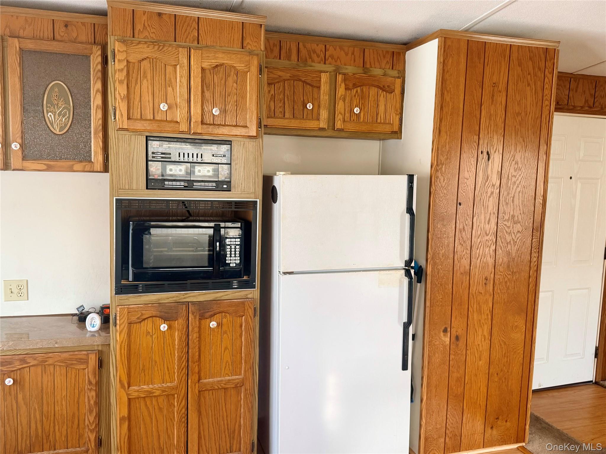 63 Tanglewood Road Hopewell Junction, NY 12533 - Photo 5 of 25 a view of a refrigerator in a kitchen