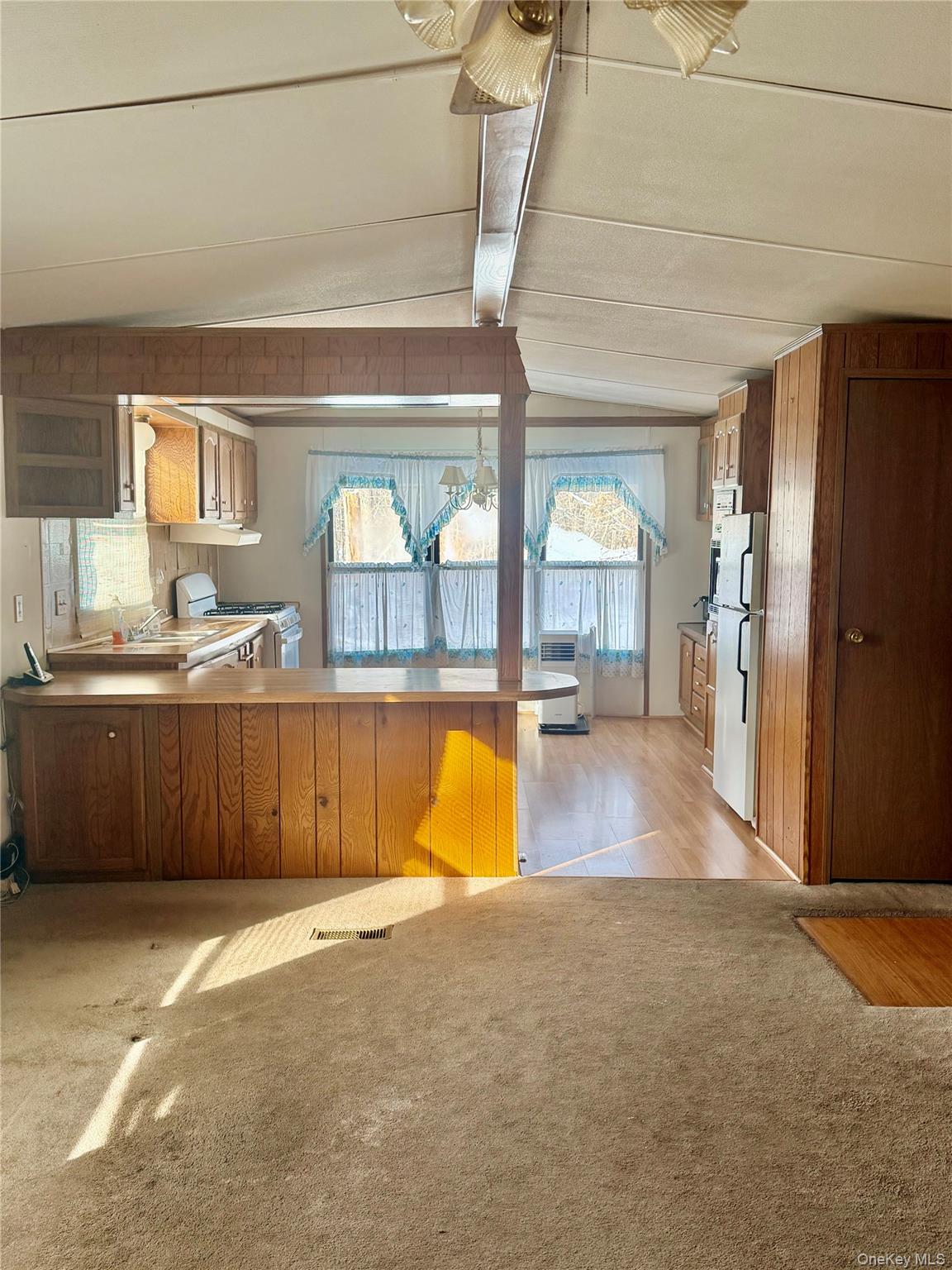 63 Tanglewood Road Hopewell Junction, NY 12533 - Photo 6 of 25 an empty room with a fireplace and windows