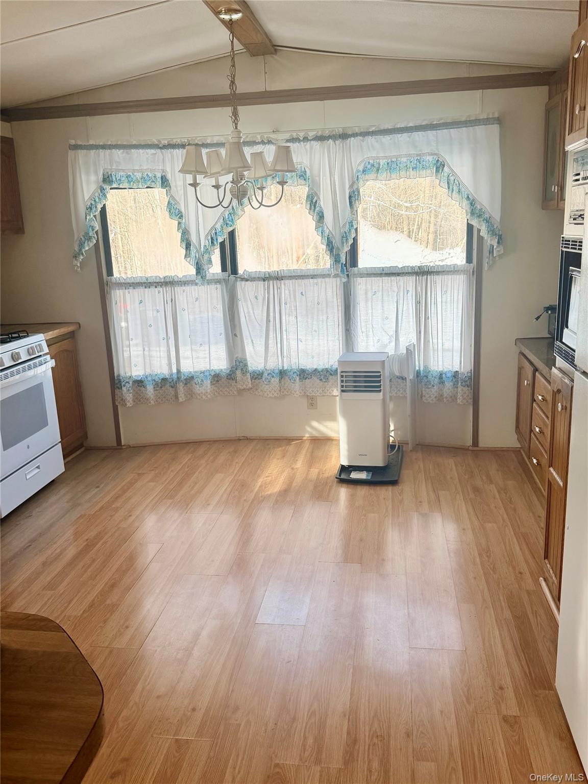 63 Tanglewood Road Hopewell Junction, NY 12533 - Photo 7 of 25 a view of empty room with wooden floor and window