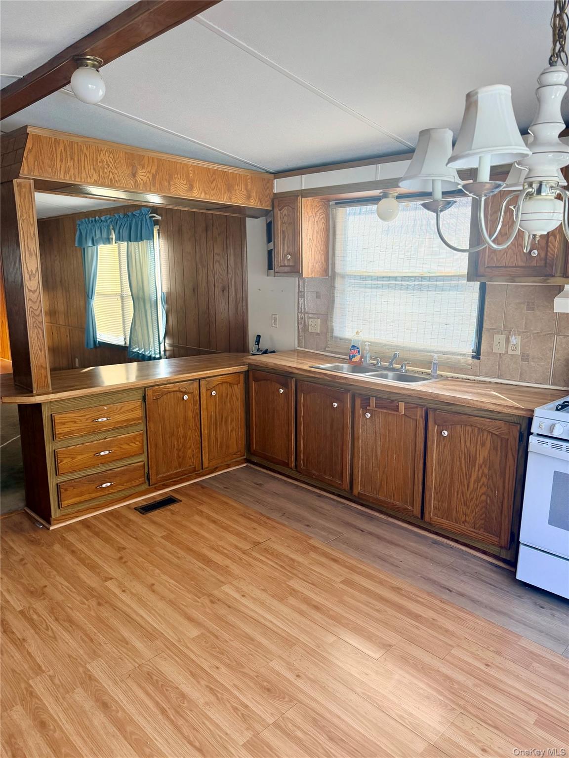 63 Tanglewood Road Hopewell Junction, NY 12533 - Photo 8 of 25 a large kitchen with wooden cabinets and a sink