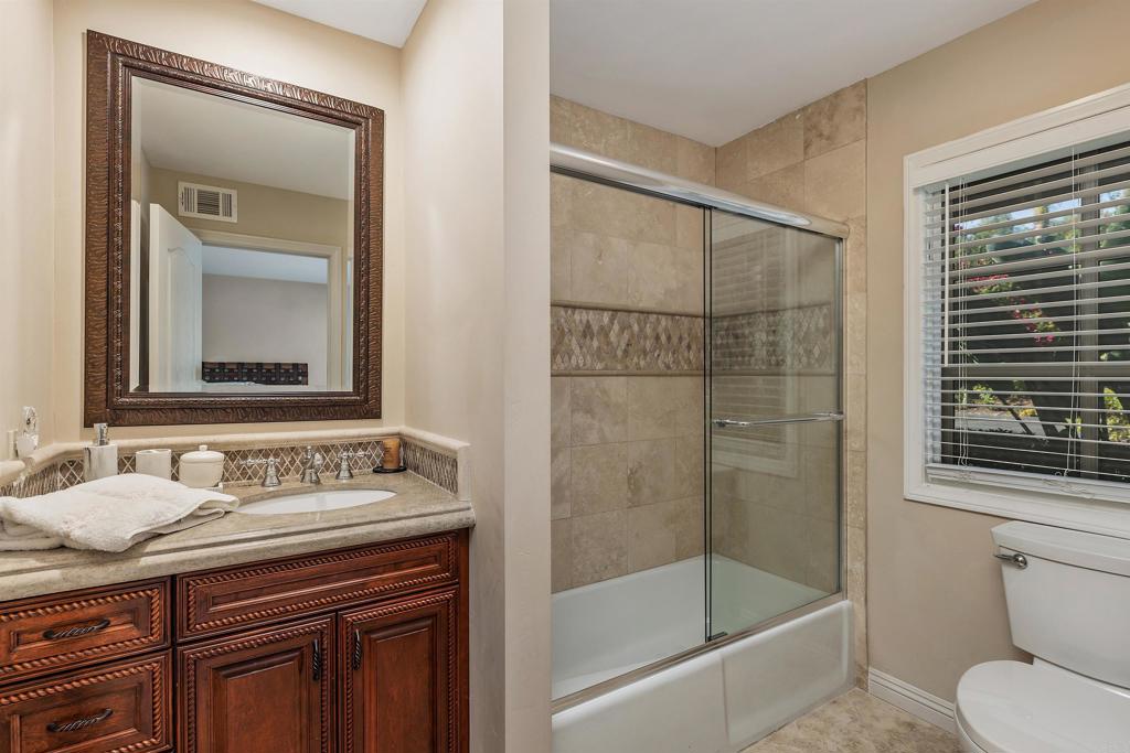 16346 Via Del Alba Rancho Santa Fe, CA 92067 - Photo 19 of 34 a bathroom with a granite countertop sink toilet and shower