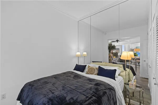 a bed room with a bed and a night stand
