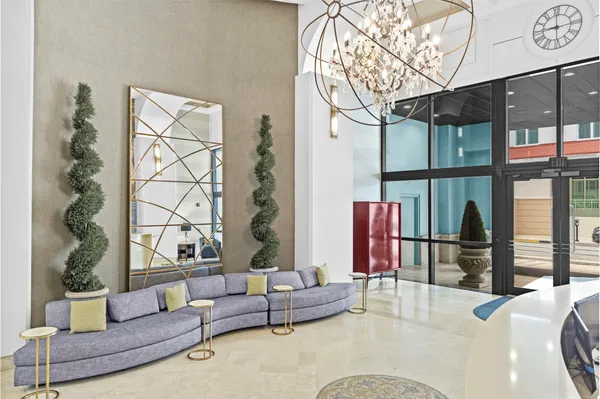 a view of a bathroom with sink and mirror