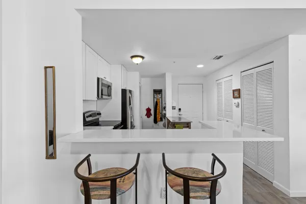 a very nice looking dining room with furniture and a window