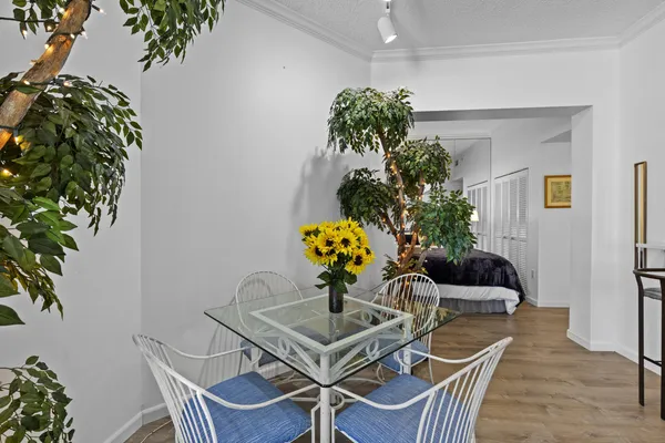 a dining room with furniture and chandelier