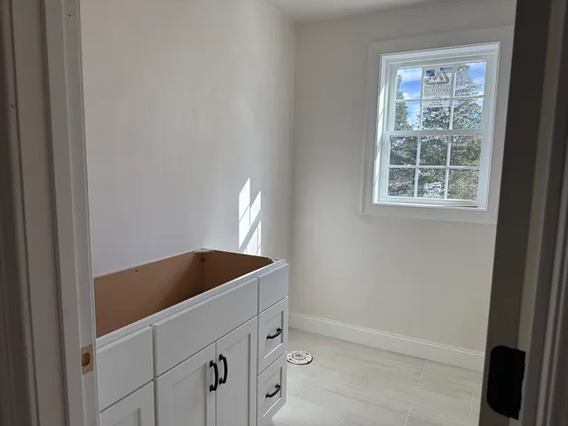 a kitchen with a sink and a window
