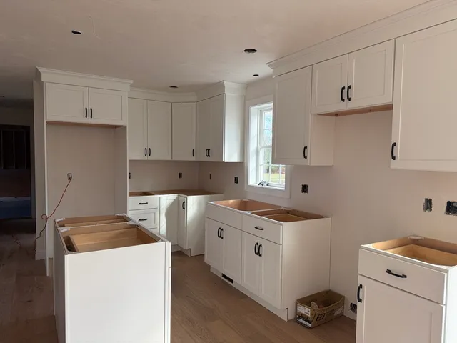 a kitchen with a stove and a refrigerator