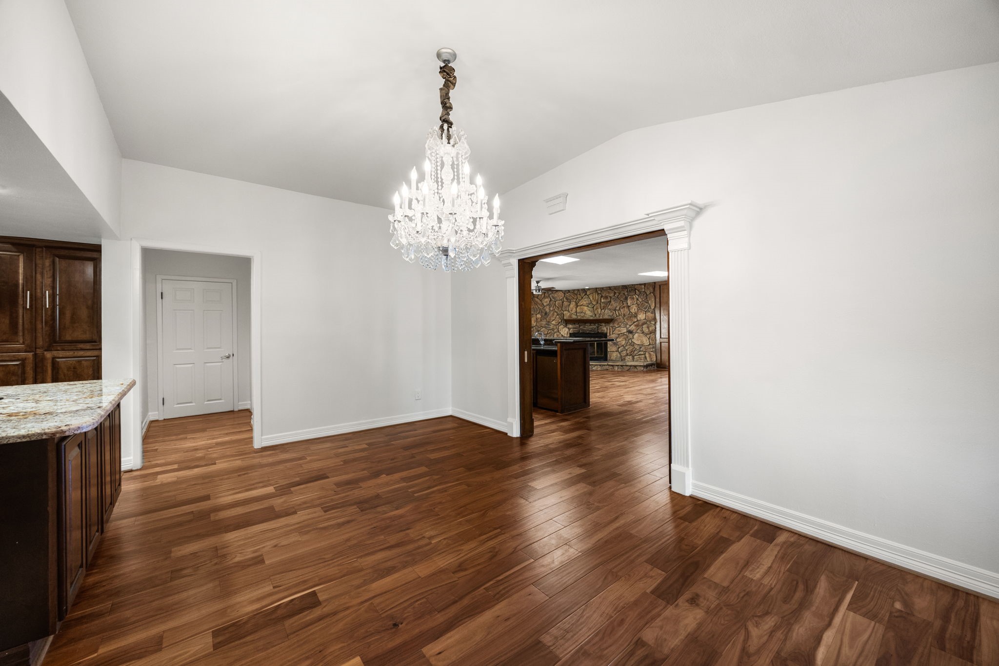10310 Mayfield Road Houston, TX 77043 - Photo 14 of 49 Dining room opens to large family room. Primary suite is behind closed door