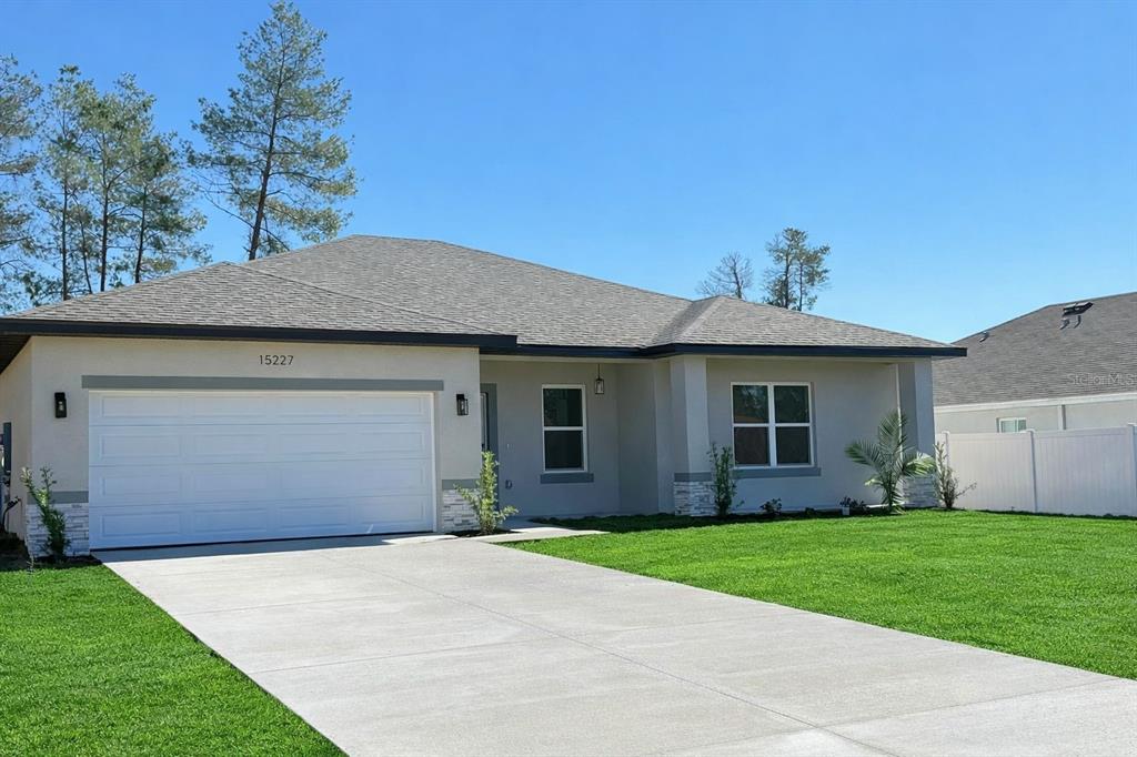 15227 Southwest 28th Avenue Road Ocala, FL 34473 - Photo 3 of 38 a house view with a garden space
