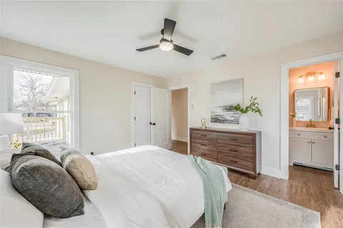 a bedroom with a bed and a dresser