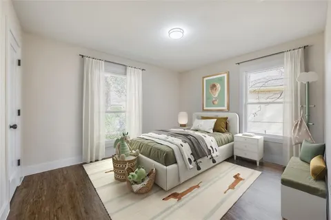 a bedroom with furniture and a window