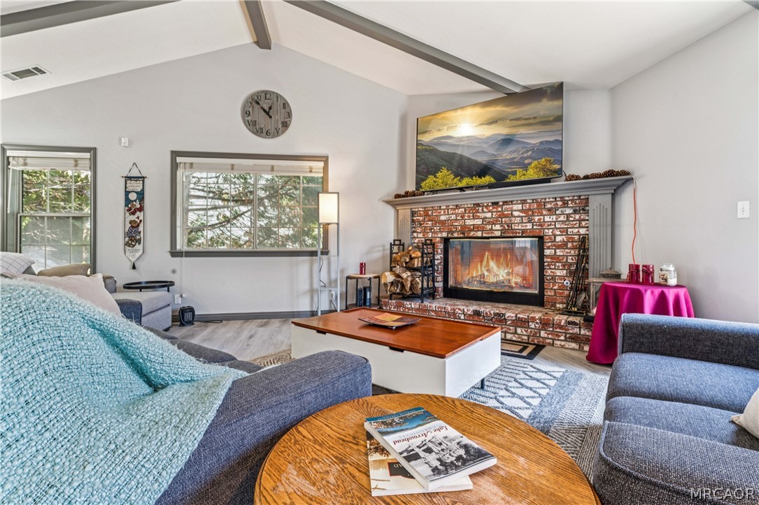 27487 North Bay Road Lake Arrowhead, CA 92352 - Photo 11 of 35 Cozy up to wood burning fireplace - fire is photoshopped