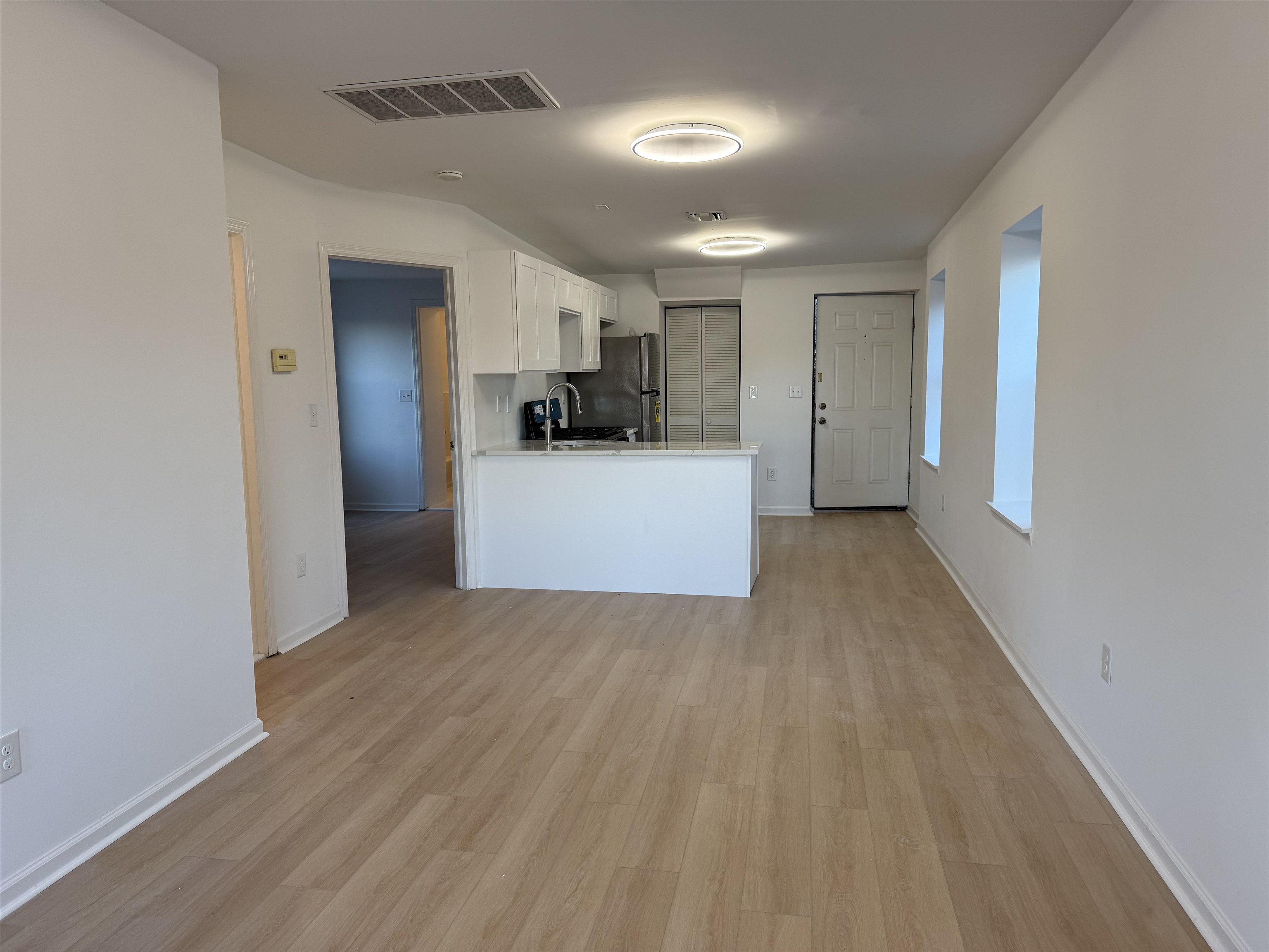 9007 Riverside Place, Unit 3 North Bergen, NJ 07047 - Photo 3 of 18 a view of a kitchen with wooden floor
