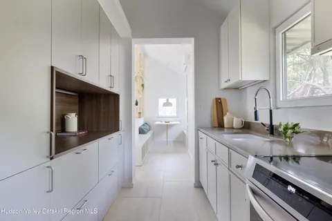 a kitchen with stainless steel appliances a sink dishwasher stove microwave and cabinets