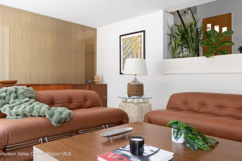 a living room with furniture and window