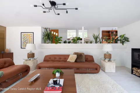 a living room with furniture and window