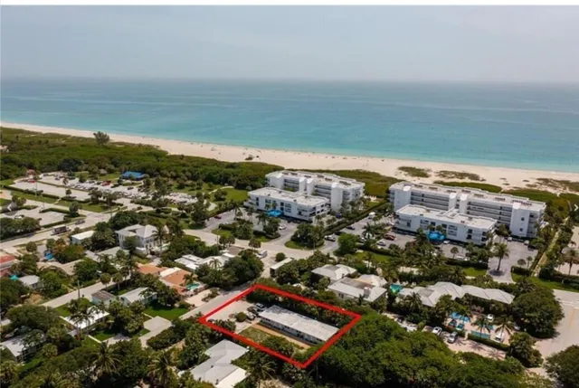 an aerial view of residential building and ocean