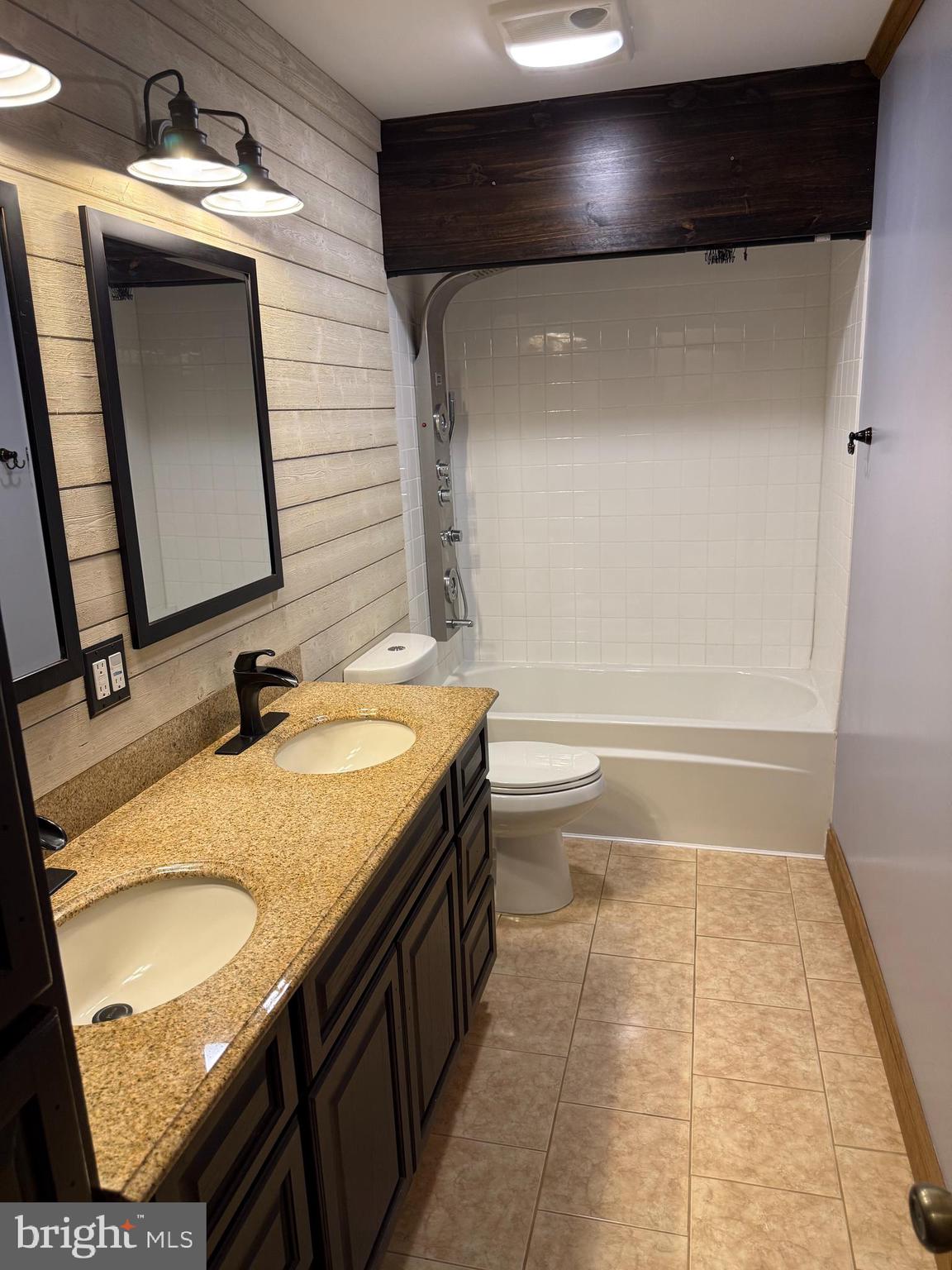 858 Star Court Union Bridge, MD 21791 - Photo 18 of 37 a bathroom with a granite countertop sink a toilet and vanity
