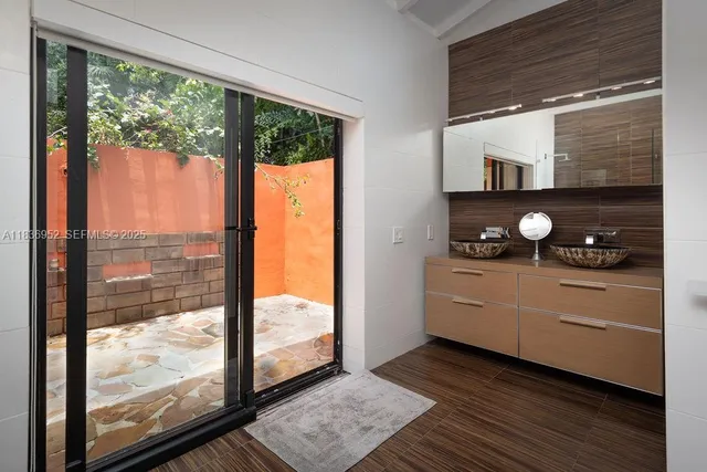 a backyard of a house with a tree