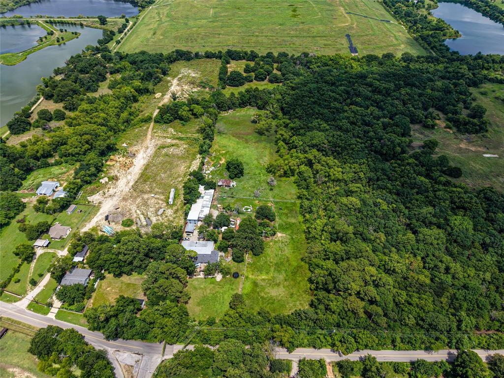 1900 Haymarket Road Dallas, TX 75253 - Photo 2 of 20 Expansive acreage featuring abundant mature trees, multiple clearings, and a substantial wooded area