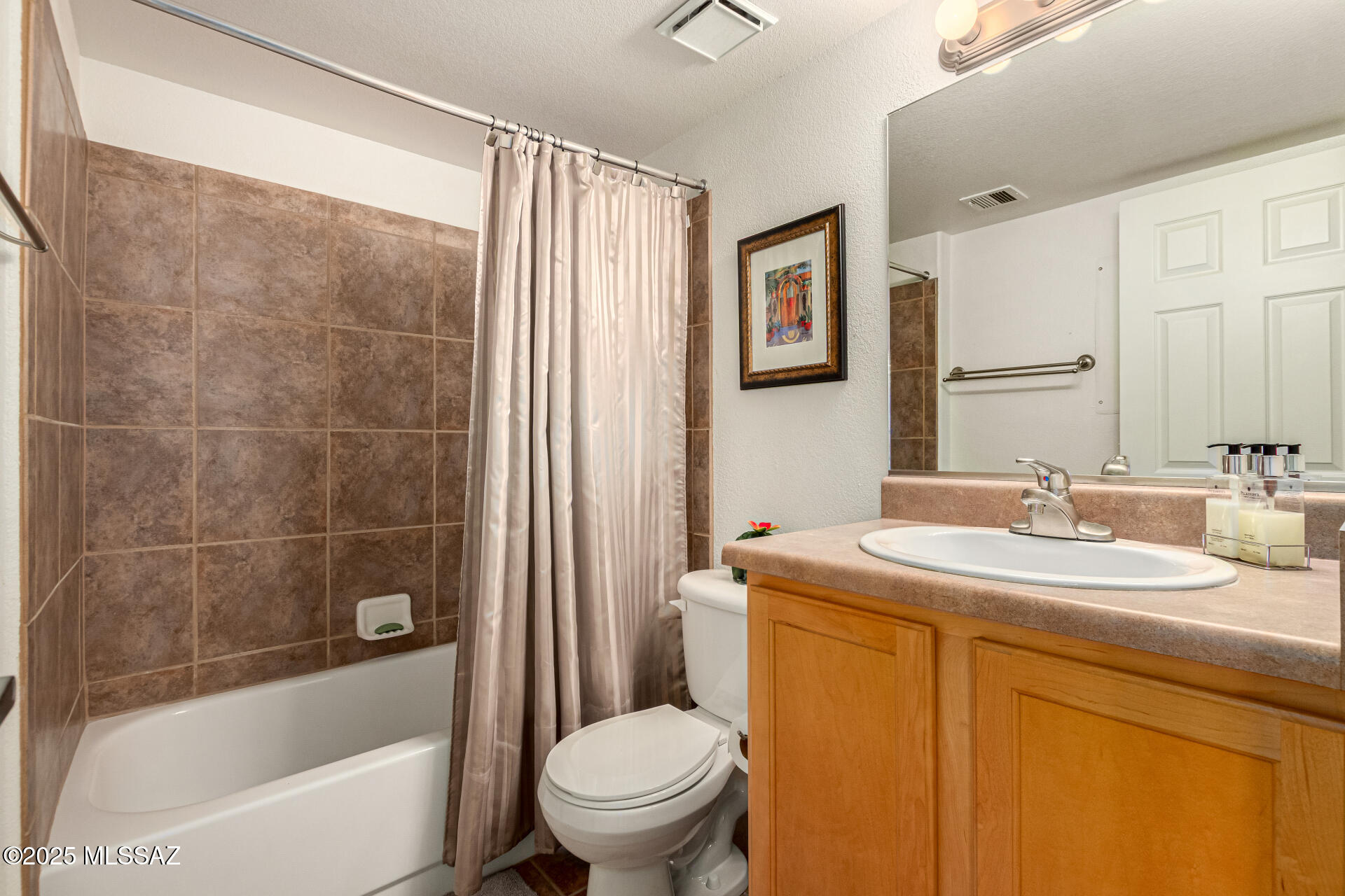 5855 North Kolb Road, Unit 8102 Tucson, AZ 85750 - Photo 11 of 28 a bathroom with a sink toilet and shower