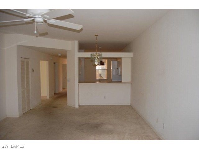 300 Robin Hood Circle, Unit 102 Naples, FL 34104 - Photo 3 of 8 a view of empty room