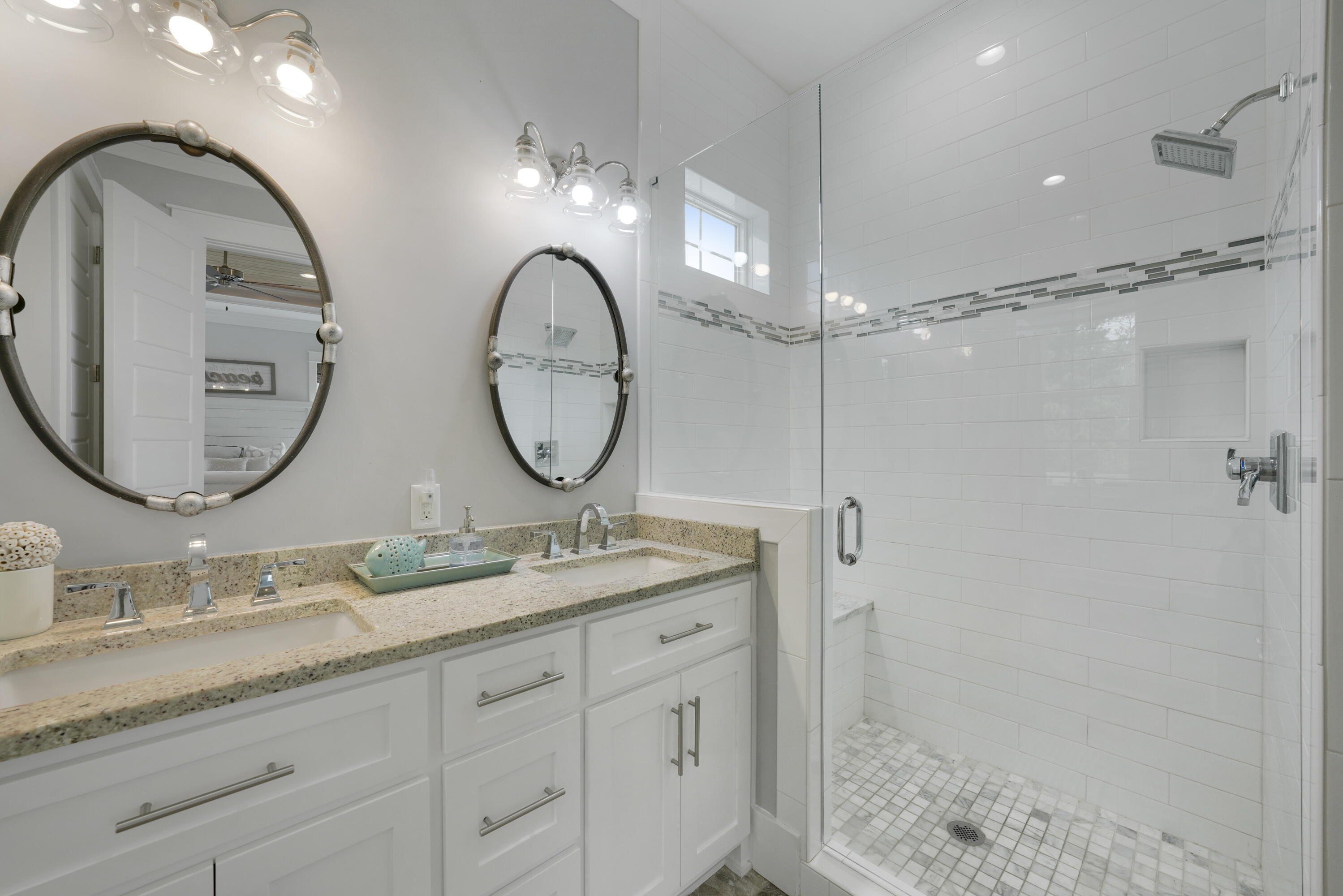 39 Lifeguard Loop West Inlet Beach, FL 32461 - Photo 37 of 57 a bathroom with a double vanity sink and a mirror