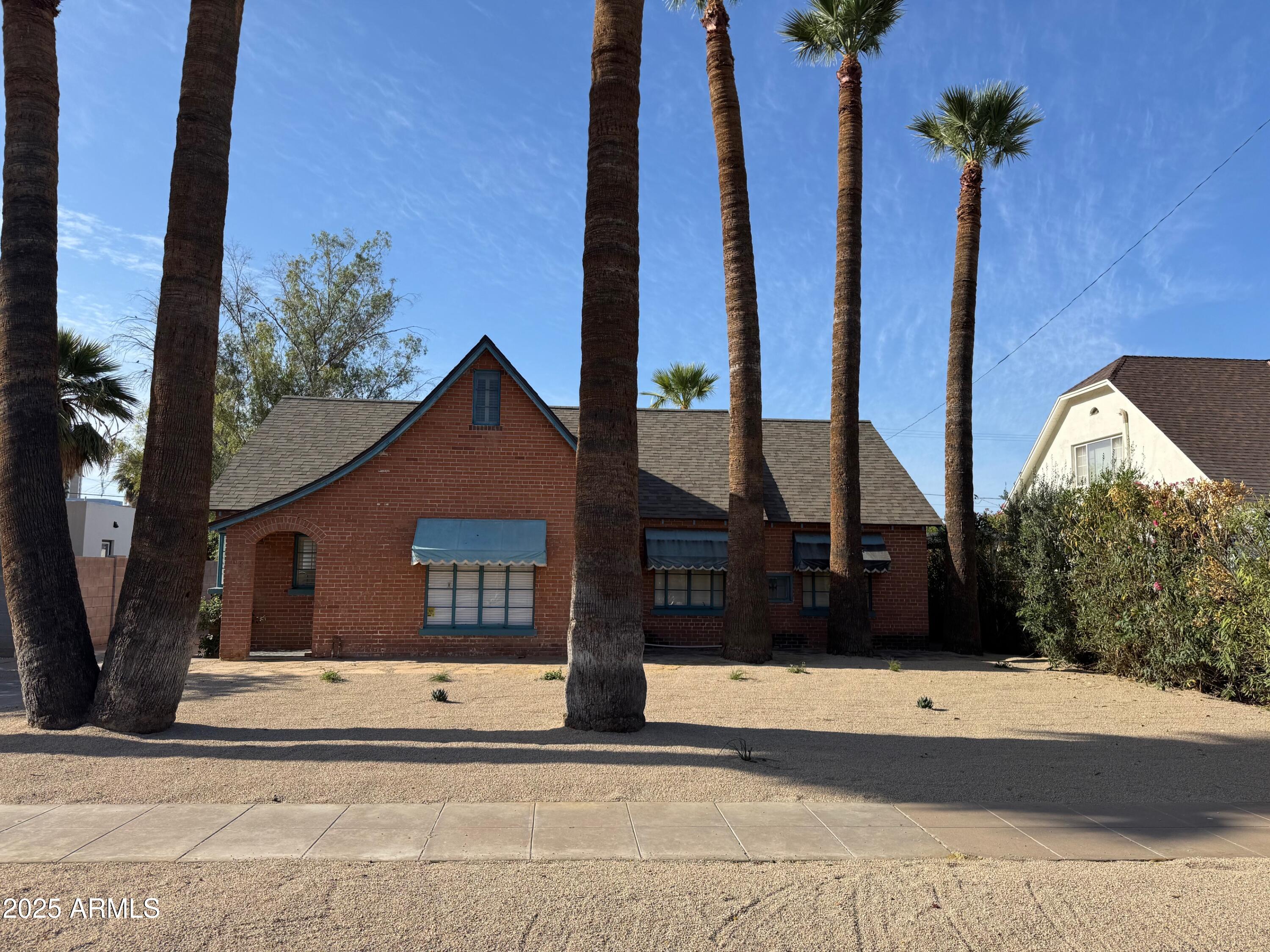 a view of a house with a yard and garage