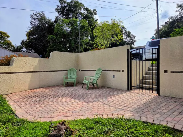 a kitchen with stainless steel appliances kitchen island granite countertop a refrigerator and a stove top oven