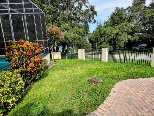 a kitchen with stainless steel appliances a refrigerator a stove and a sink with wooden floor