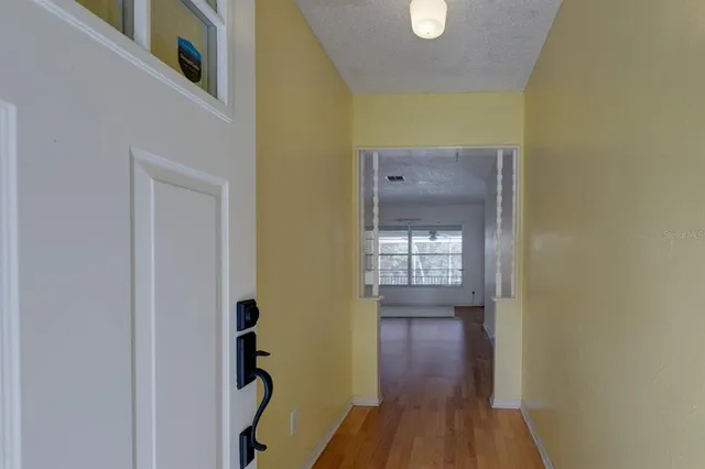a view of an empty room with a window