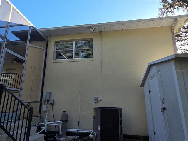 a view of a chair and tables in the balcony