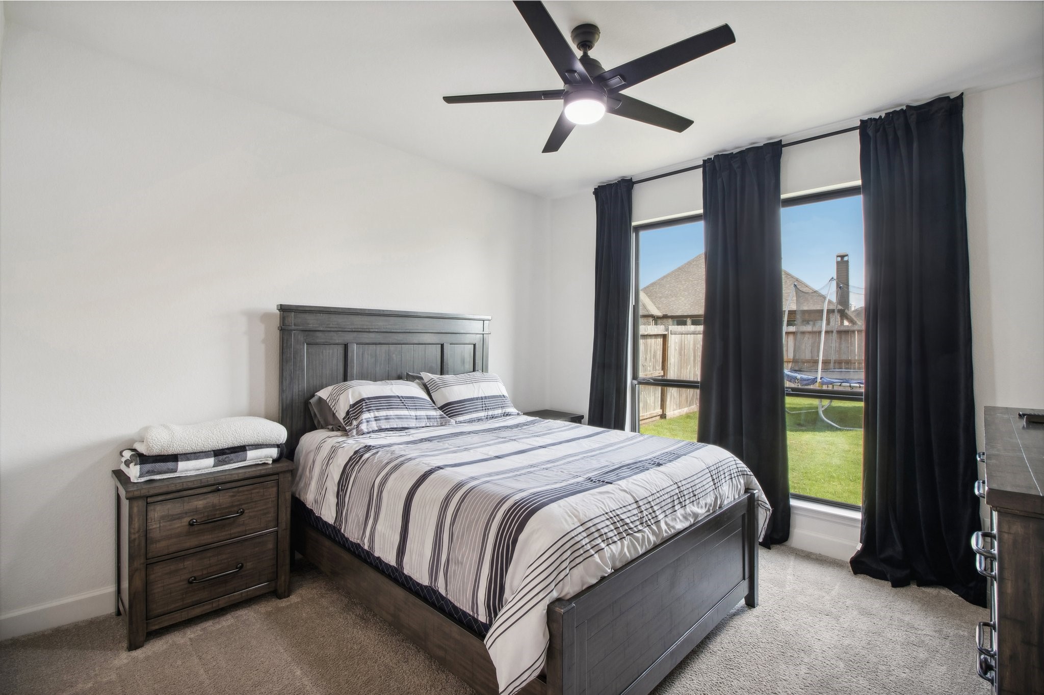 29819 Autumn Maple Court Fulshear, TX 77494 - Photo 20 of 47 a bedroom with a large bed and a window