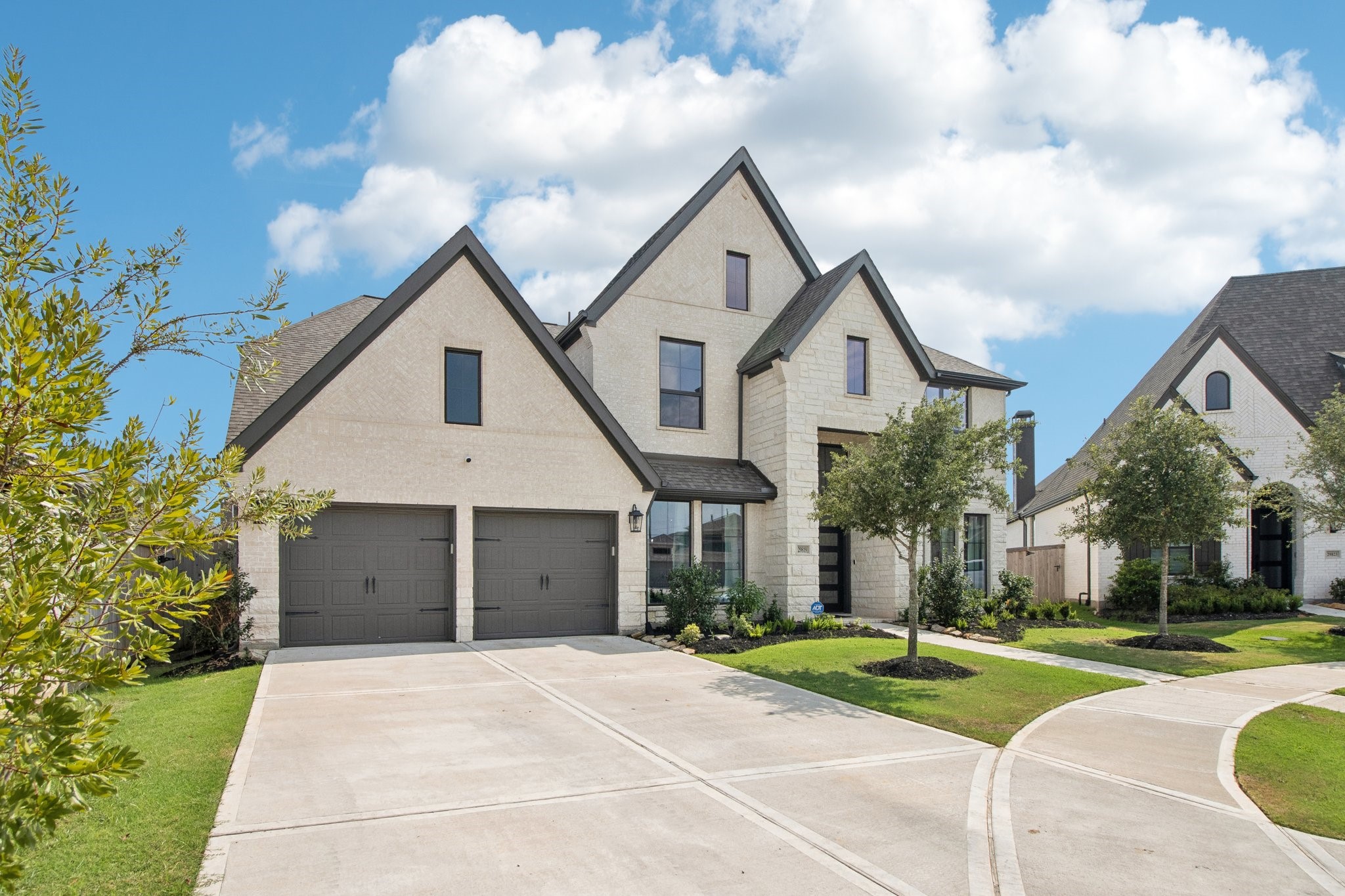 29819 Autumn Maple Court Fulshear, TX 77494 - Photo 2 of 47 a front view of a house with a yard and garage